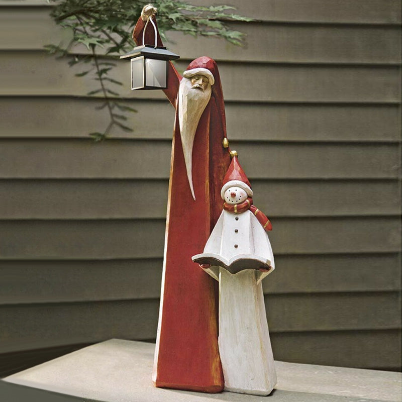 Weihnachtsmann- und Schneemann-Skulptur