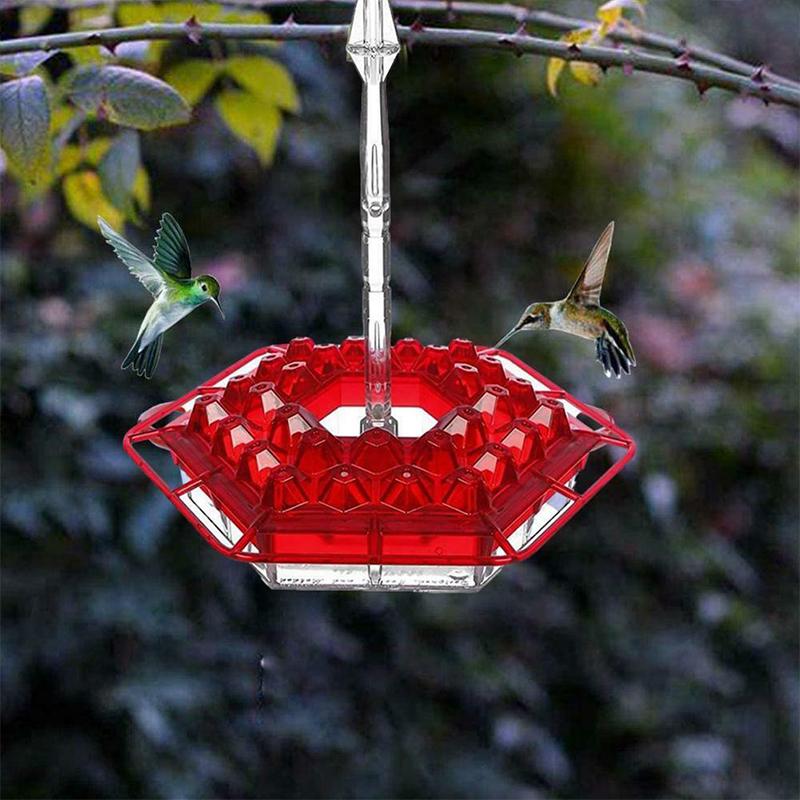 Hängende rote sechseckige Kolibri-Fütterungsanlage