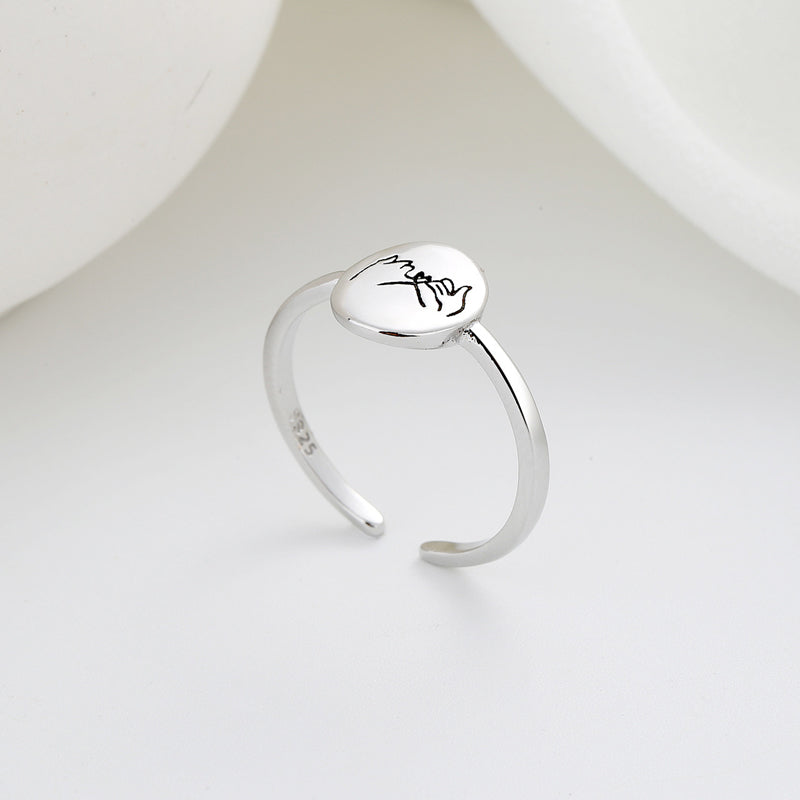 Romantischer verstellbarer Ring mit Hand-in-Hand-Muster