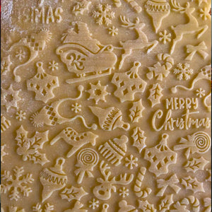 Nudelholz mit Weihnachtsmotiven